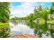 Scenic waterfront with river view and reflections of nearby houses at 429 E Hoover Dr, Nineveh, IN 46164