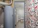 Modest bathroom features a toilet, vanity, and a shower with a playful butterfly-themed curtain at 4305 Clinton St, Lawrence, IN 46226
