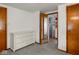 Cozy bedroom provides access to bathroom, offers great natural light, and neutral decor at 4305 Clinton St, Lawrence, IN 46226