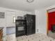 Kitchen with tile flooring and view to living room at 4305 Clinton St, Lawrence, IN 46226