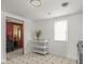 Kitchen with mobile island and view to hallway at 4305 Clinton St, Lawrence, IN 46226