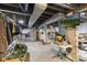 Spacious unfinished basement with TV and potential for storage or workshop at 441 N Temple Ave, Indianapolis, IN 46201