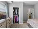Bedroom with walk-in closet, closet organizer and adjacent dresser at 441 N Temple Ave, Indianapolis, IN 46201