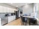 Spacious kitchen with stainless steel appliances, granite countertops, and eat-in dining at 441 N Temple Ave, Indianapolis, IN 46201