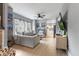 Open-concept living room featuring an airy feel, modern decor, and wood laminate floors at 441 N Temple Ave, Indianapolis, IN 46201
