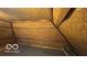 Unfinished attic space featuring wooden beams and plywood sheathing, offering potential for customization at 4526 Iowa St, Clayton, IN 46118