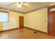 Bedroom with hardwood floors, stained glass door, and large window at 4526 Iowa St, Clayton, IN 46118