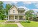 Charming two-story home with a covered front porch, a well-manicured lawn, and mature trees in a desirable neighborhood at 4526 Iowa St, Clayton, IN 46118