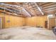 Spacious garage interior with plywood walls, high ceilings, and ample storage potential at 4526 Iowa St, Clayton, IN 46118