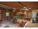 Spacious garage featuring concrete floors and containing tools, machinery, and storage for a variety of household and yard equipment at 4526 Iowa St, Clayton, IN 46118