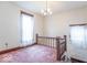 Upstairs landing area with vintage window and lighting at 4526 Iowa St, Clayton, IN 46118