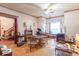 Spacious living room featuring hardwood floors, vintage decor, and chandelier lighting at 4526 Iowa St, Clayton, IN 46118