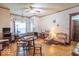 Cozy living room with hardwood floors, vintage furnishings, and lots of natural light at 4526 Iowa St, Clayton, IN 46118