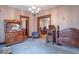 Inviting living room featuring traditional furnishings, a decorative chandelier, and multiple doorways that enhance the flow at 4526 Iowa St, Clayton, IN 46118