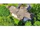Aerial view of the rear of this stately home, featuring a patio and a partially covered outdoor space at 4623 E Windsor Ln, Columbus, IN 47201