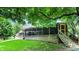Beautiful backyard with a spacious deck and lush greenery providing privacy at 4623 E Windsor Ln, Columbus, IN 47201