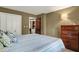 Bedroom featuring a comfortable bed, bedside lamps, and closet providing a relaxing private space at 4623 E Windsor Ln, Columbus, IN 47201