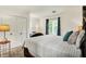 Bedroom with a comfortable bed, side table, and soft lighting creating a relaxing and inviting atmosphere at 4623 E Windsor Ln, Columbus, IN 47201