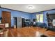Spacious bedroom offering hardwood floors, a large window, and ample space for furniture at 4623 E Windsor Ln, Columbus, IN 47201