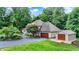 View of the side exterior of the home, as well as the additional garage at 4623 E Windsor Ln, Columbus, IN 47201