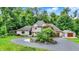 A charming two-story home with a circular driveway and meticulously maintained landscaping at 4623 E Windsor Ln, Columbus, IN 47201