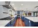 Gourmet kitchen featuring a long island, a stainless steel range hood, and stainless steel appliances at 4623 E Windsor Ln, Columbus, IN 47201
