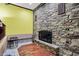 Bright living room boasts a stone fireplace and beautiful hardwood floors at 4623 E Windsor Ln, Columbus, IN 47201