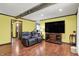 Inviting living room with hardwood floors, ceiling beams, and comfortable seating at 4623 E Windsor Ln, Columbus, IN 47201