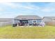 The large backyard includes a patio with both lounge and dining furniture and a gazebo at 485 Thunderwood Dr, Greenfield, IN 46140