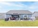 Expansive backyard patio with gazebo, outdoor seating, dining set, and manicured lawn at 485 Thunderwood Dr, Greenfield, IN 46140