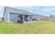 The large backyard features an outdoor seating area with a gazebo, a patio table, and lounge seating at 485 Thunderwood Dr, Greenfield, IN 46140