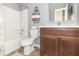 This bathroom includes a tub/shower, a toilet, and a vanity with a wood cabinet at 485 Thunderwood Dr, Greenfield, IN 46140
