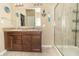 Well-lit bathroom featuring double sinks, granite countertops, and a glass-enclosed shower at 485 Thunderwood Dr, Greenfield, IN 46140