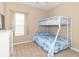 Cozy bedroom with a bunk bed, soft carpet, and a bright window at 485 Thunderwood Dr, Greenfield, IN 46140