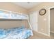 Bright bedroom with a bunk bed, soft carpet, and a closet at 485 Thunderwood Dr, Greenfield, IN 46140
