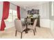 Elegant dining room with a glass-top table, comfortable chairs, and stylish decor at 485 Thunderwood Dr, Greenfield, IN 46140