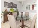 Tastefully decorated dining room with a glass table, upholstered chairs, and stylish buffet at 485 Thunderwood Dr, Greenfield, IN 46140