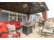 Cozy gazebo features comfortable seating, a fire pit table, and elegant curtains for privacy at 485 Thunderwood Dr, Greenfield, IN 46140