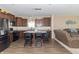 Spacious kitchen with stainless steel appliances, center island, and views into the adjacent living area at 485 Thunderwood Dr, Greenfield, IN 46140