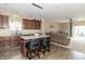 Open kitchen boasts a center island with bar stool seating and is open to the comfortable living room at 485 Thunderwood Dr, Greenfield, IN 46140