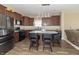 Beautiful kitchen features stainless steel appliances, tile backsplash and a center island with pendant lighting at 485 Thunderwood Dr, Greenfield, IN 46140