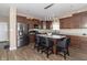 Stylish kitchen features stainless steel appliances, tile backsplash and a center island with bar stool seating at 485 Thunderwood Dr, Greenfield, IN 46140