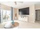 Inviting living room with sliding glass door to patio and entertainment center at 485 Thunderwood Dr, Greenfield, IN 46140