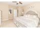 Bright main bedroom with a tufted headboard, side tables, and neutral decor at 485 Thunderwood Dr, Greenfield, IN 46140