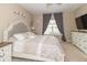 Serene main bedroom with a tufted headboard, side tables, and neutral decor at 485 Thunderwood Dr, Greenfield, IN 46140