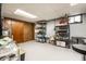 A finished basement with storage racks and overhead lighting at 4912 Central Ave, Indianapolis, IN 46205