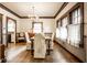 Cozy dining room with hardwood floors, a chandelier and lots of natural light at 4912 Central Ave, Indianapolis, IN 46205