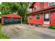 Home exterior with a detached garage, and a paved driveway at 4912 Central Ave, Indianapolis, IN 46205