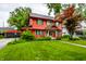Beautiful two-story home with a detached garage and green lawn at 4912 Central Ave, Indianapolis, IN 46205