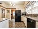 Kitchen with tile floors, bright natural light and modern appliances at 4912 Central Ave, Indianapolis, IN 46205